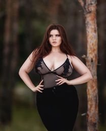 Busty brunette taking a